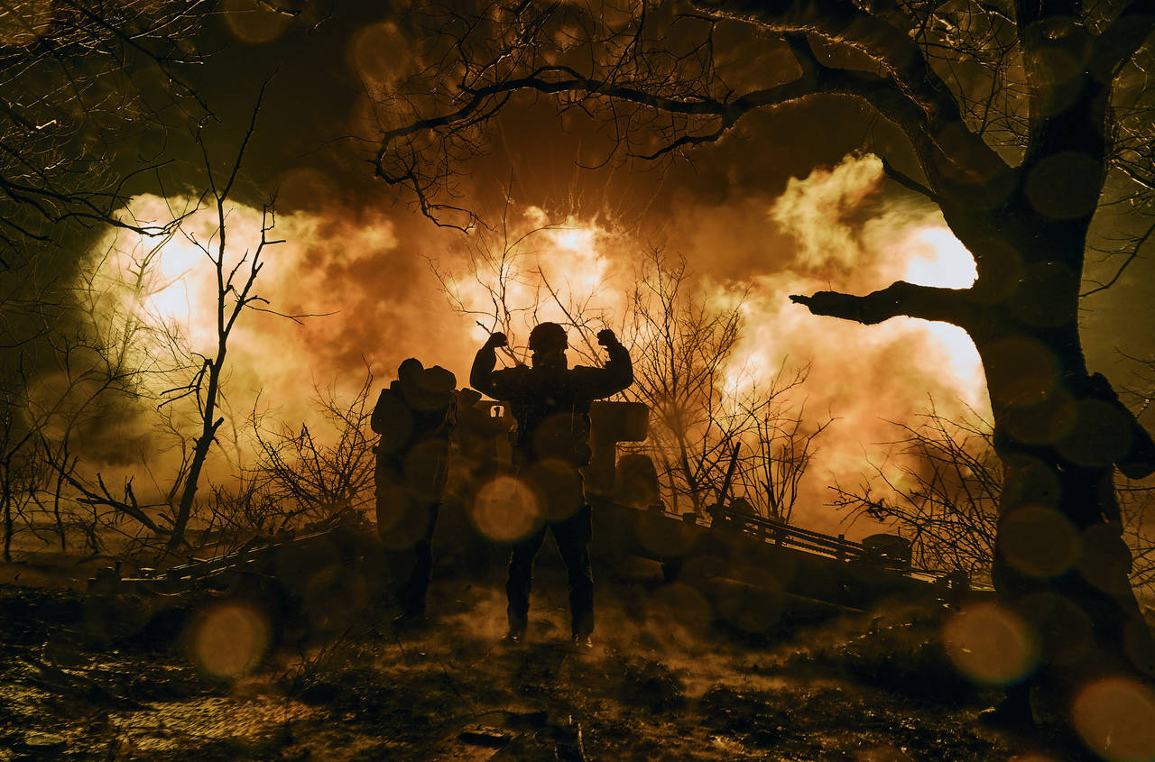 Ukrainian soldiers fire an artillery at Russian positions near Bakhmut, Donetsk region, Ukraine, Su...