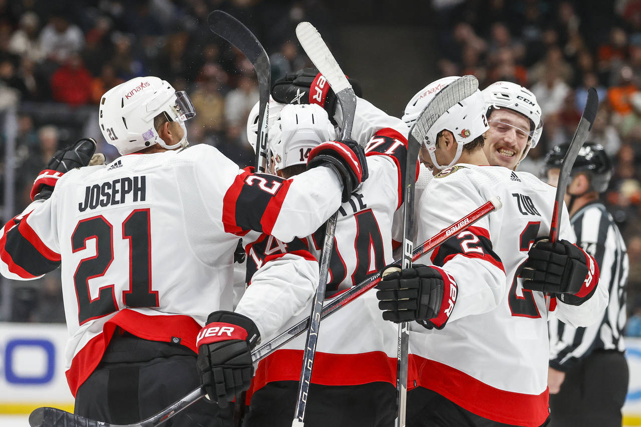 Ottawa Senators defenseman Artem Zub, second from right, celebrates his goal with teammates during ...