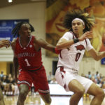 Black's 26 points carry No. 9 Arkansas past Louisville 80-54