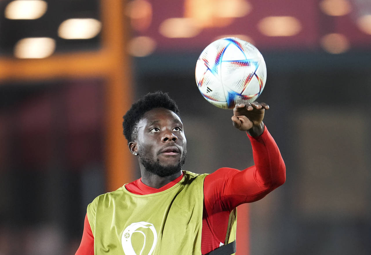 Canada forward Alphonso Davies plays with the ball during practice at the World Cup soccer tourname...