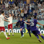 Messi and Argentina advance at World Cup, beat Poland 2-0
