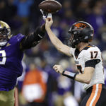 
              Washington defensive lineman Jeremiah Martin (3) blocks a pass from Oregon State quarterback Ben Gulbranson (17) during the first half of an NCAA college football game Friday, Nov. 4, 2022, in Seattle. (AP Photo/John Froschauer)
            