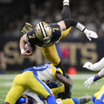 Dalton thrives, Stafford leaves, as Saints top Rams 27-20