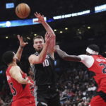 Fox has 27 points and 10 assists, Kings beat Raptors 124-123