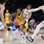 Roach leads No. 15 Duke past Iowa 74-62 in Jimmy V Classic