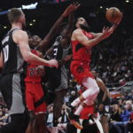 Fox has 27 points and 10 assists, Kings beat Raptors 124-123