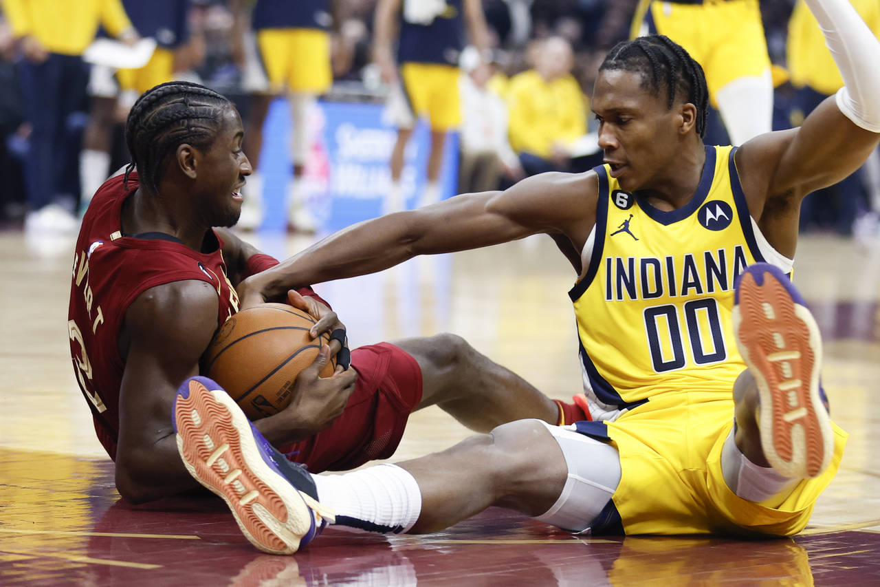 Indiana Pacers guard Bennedict Mathurin (00) and Cleveland Cavaliers guard Caris LeVert (3) battle ...