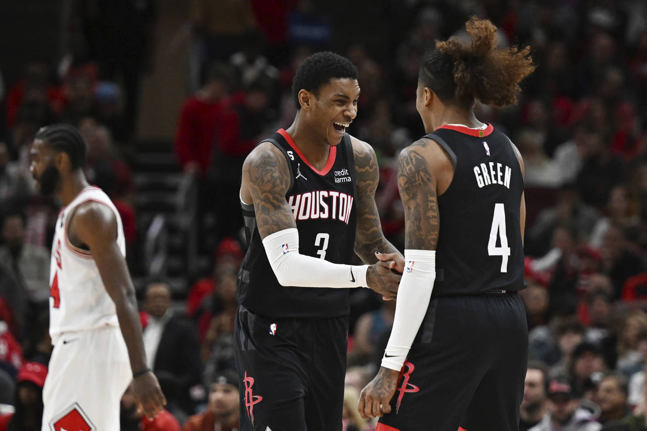 Houston Rockets guard Kevin Porter Jr. (3) celebrates with guard Jalen Green (4) after making a 3-p...