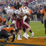 Wisconsin beats Oklahoma State 24-17 in Guaranteed Rate Bowl