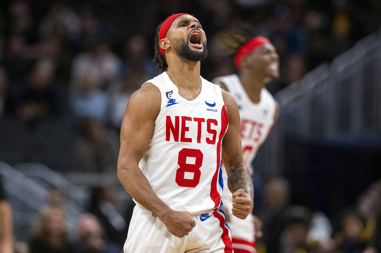 Brooklyn Nets guard Patty Mills (8) reacts during the second half of an NBA basketball game against...