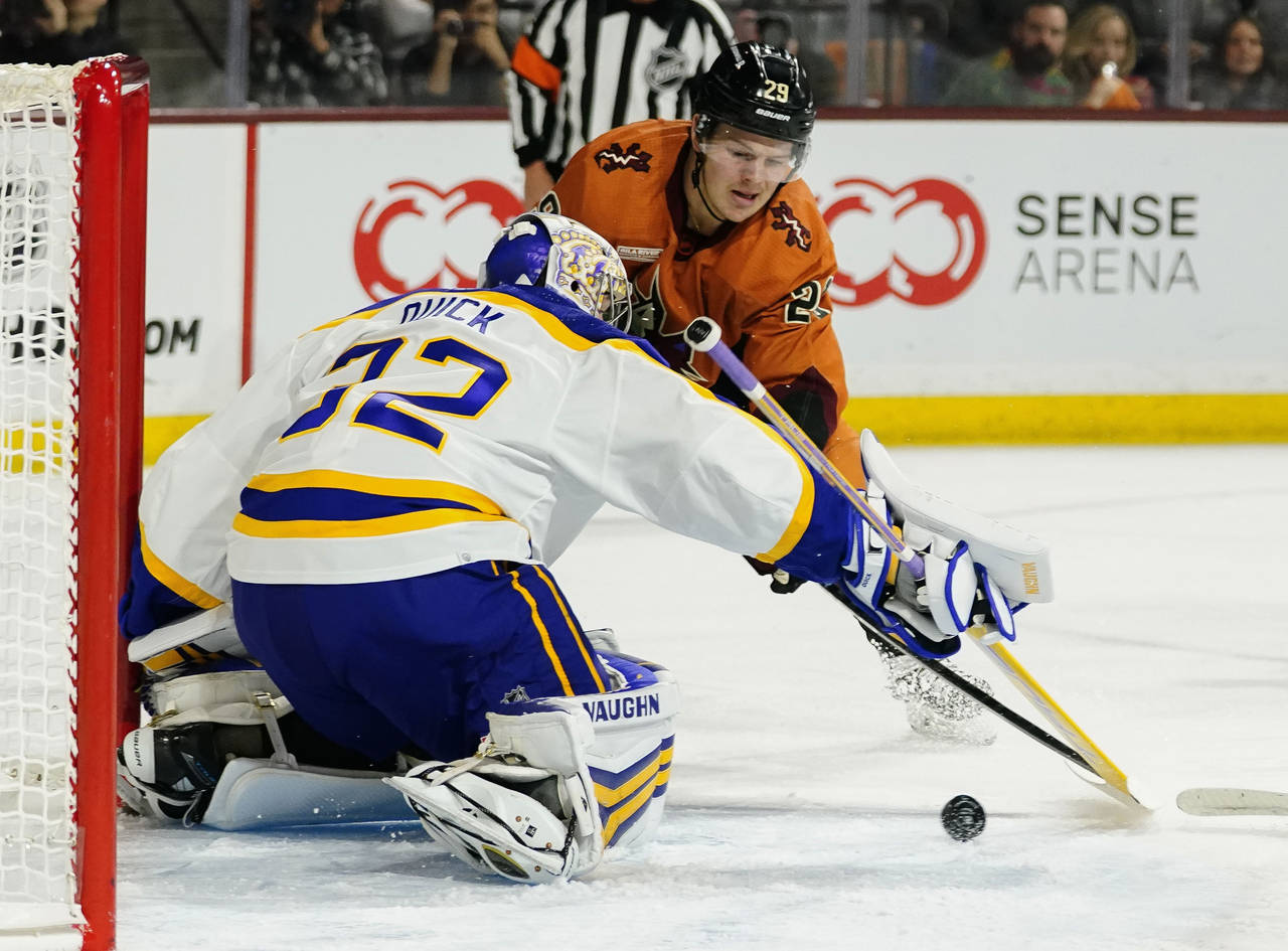 Arizona Coyotes' Barrett Hayton (29) shoots against Los Angeles Kings goalie Jonathan Quick (32) in...