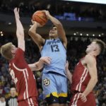 Hepburn paces Wisconsin to 80-77 OT win over Marquette