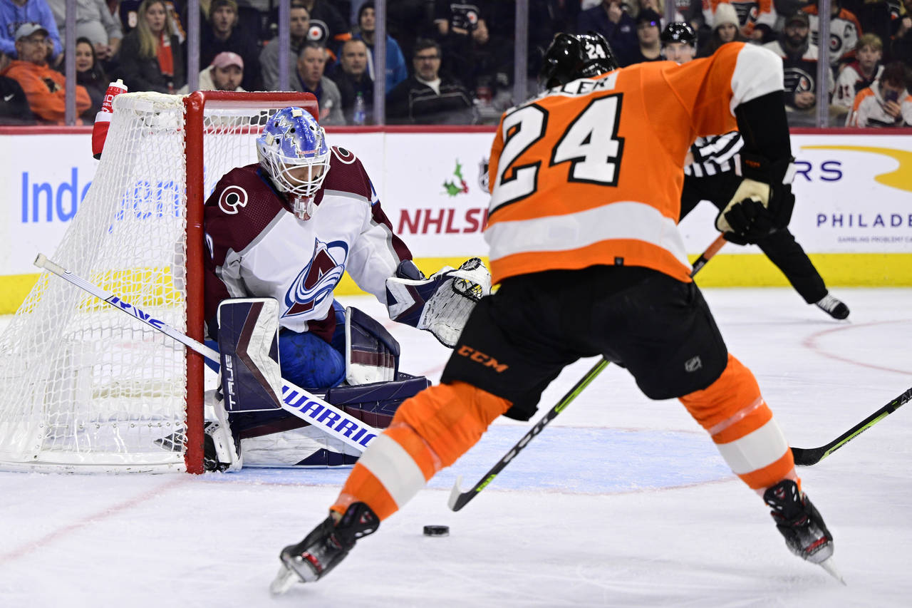 Colorado Avalanche goaltender Alexandar Georgiev looks to make a save on a shot from Philadelphia F...