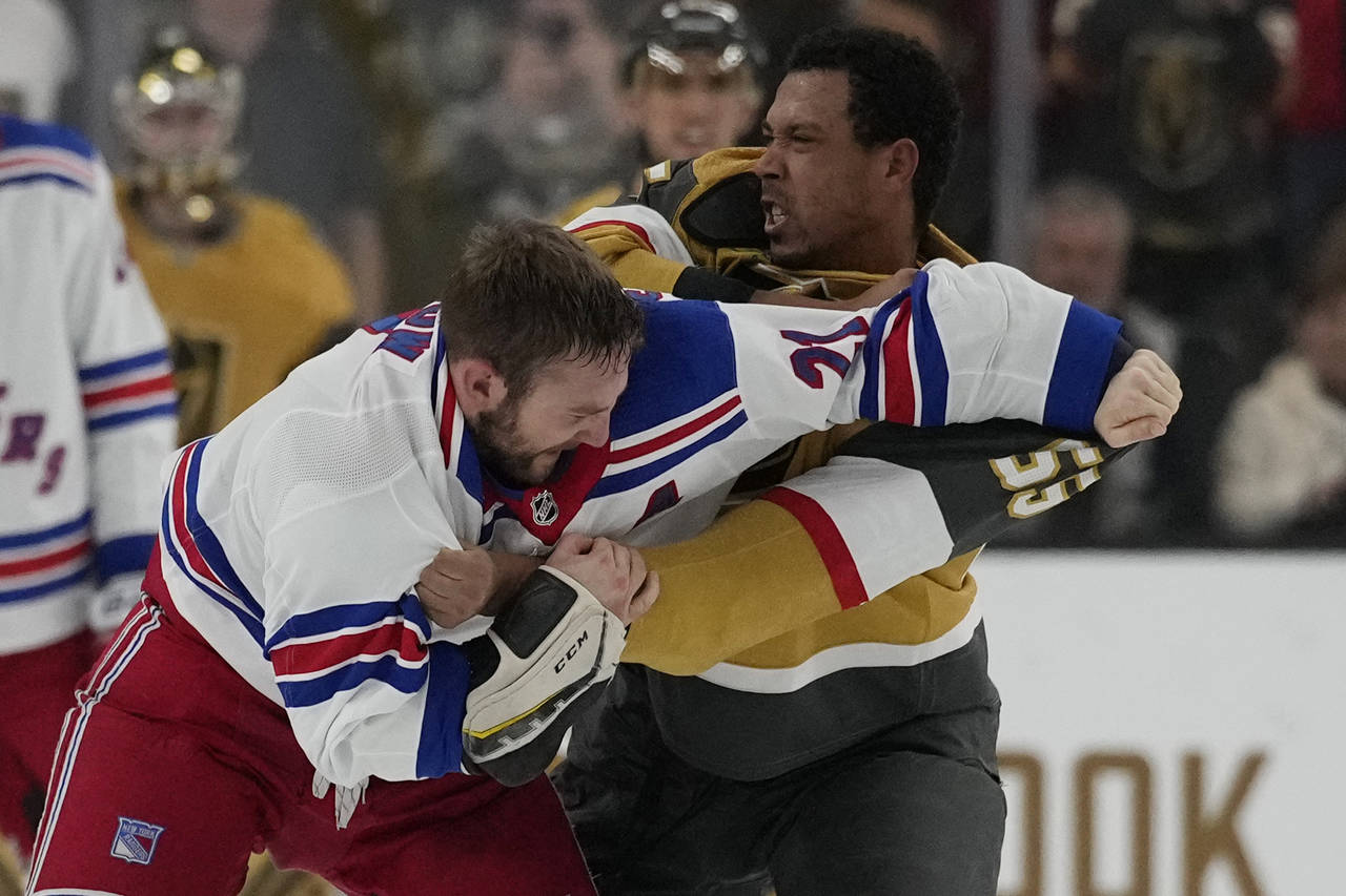 New York Rangers center Barclay Goodrow (21) and Vegas Golden Knights right wing Keegan Kolesar (55...