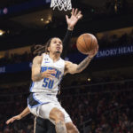 Murray hits winning free throws, Hawks end Magic's streak