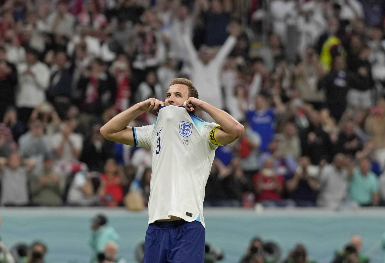 England's Harry Kane reacts after he missed a penalty kick during the World Cup quarterfinal soccer...
