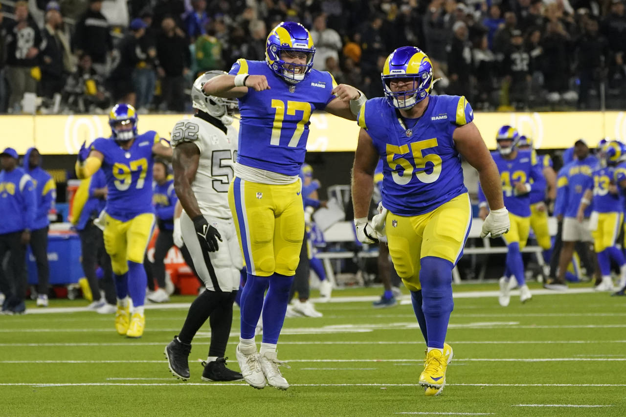 Los Angeles Rams quarterback Baker Mayfield (17) celebrates a touchdown by wide receiver Van Jeffer...