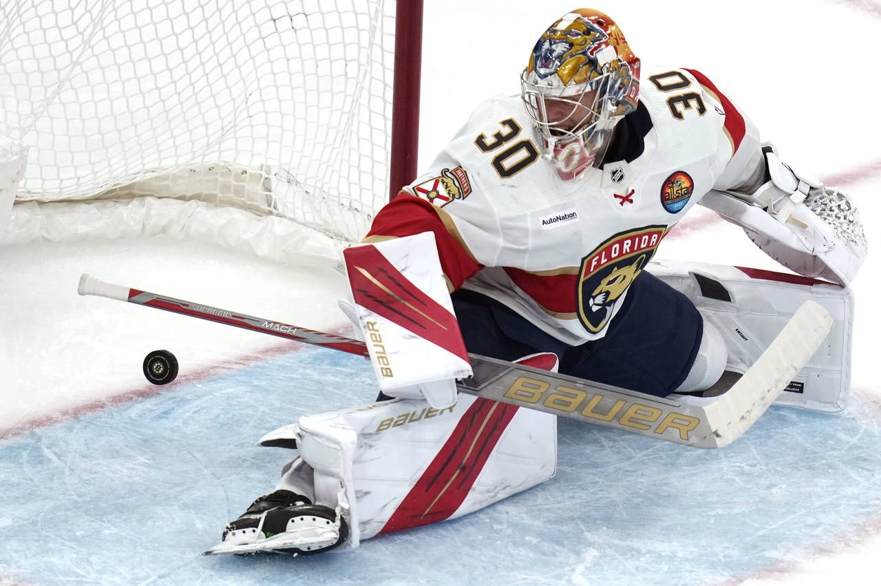 Florida Panthers goaltender Spencer Knight (30) watches as the puck rolls over the goal line on a g...