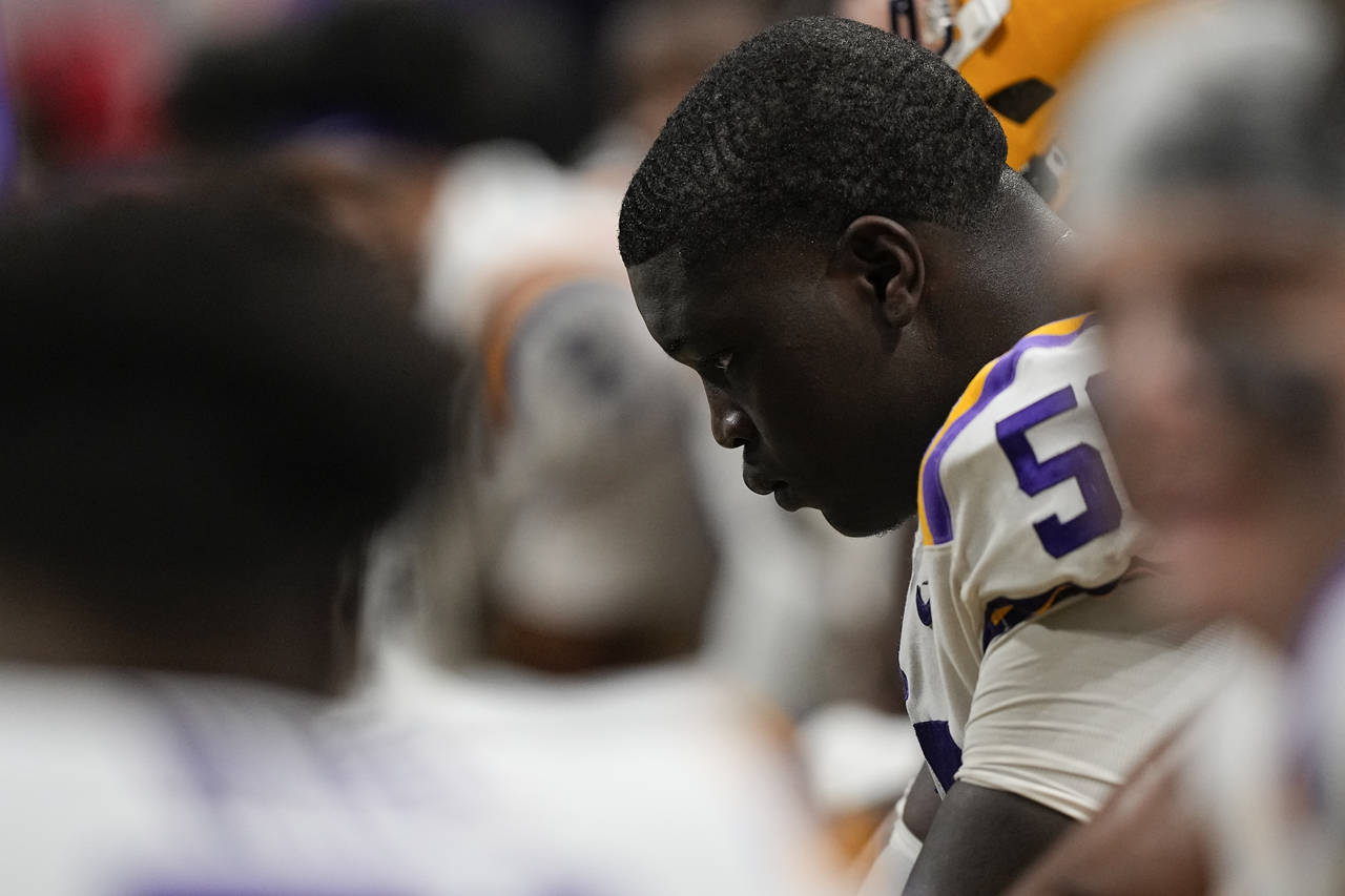 LSU offensive lineman Emery Jones (50) sits on the bench during the Southeastern Conference champio...