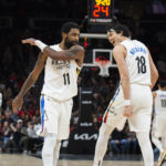 Nets win 10th straight, beating short-handed Hawks 108-107