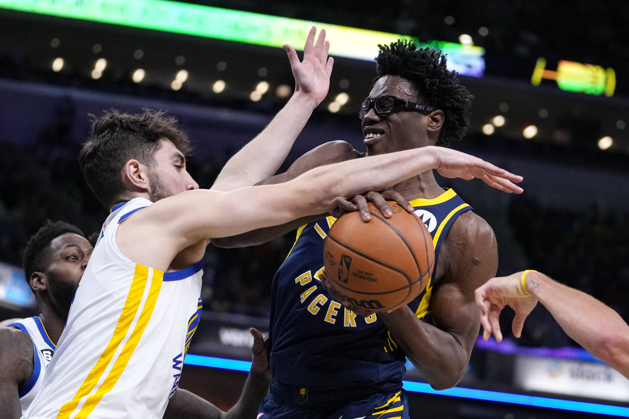 Indiana Pacers forward Jalen Smith (25) is fouled by Golden State Warriors guard Ty Jerome (10) dur...