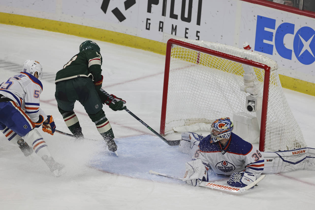 Minnesota Wild center Sam Steel (13) scores a goal against Edmonton Oilers goaltender Jack Campbell...
