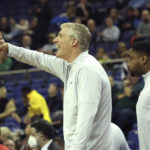 US college hoops game clashes with World Cup fever in London