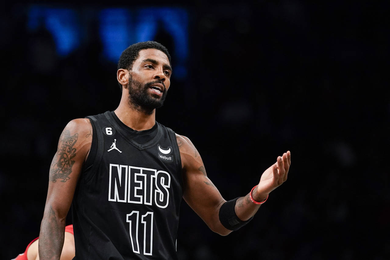 Brooklyn Nets guard Kyrie Irving (11) gestures during the first half of the team's NBA basketball g...