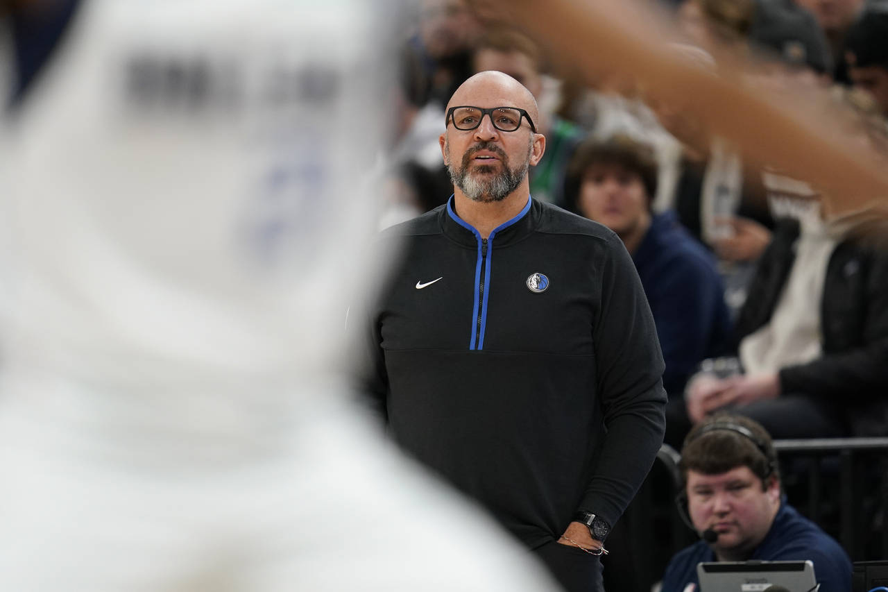 Dallas Mavericks head coach Jason Kidd watches play during the first half of an NBA basketball game...