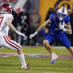 Kansas rallies, but Arkansas wins Liberty Bowl 55-53 in 3OTs