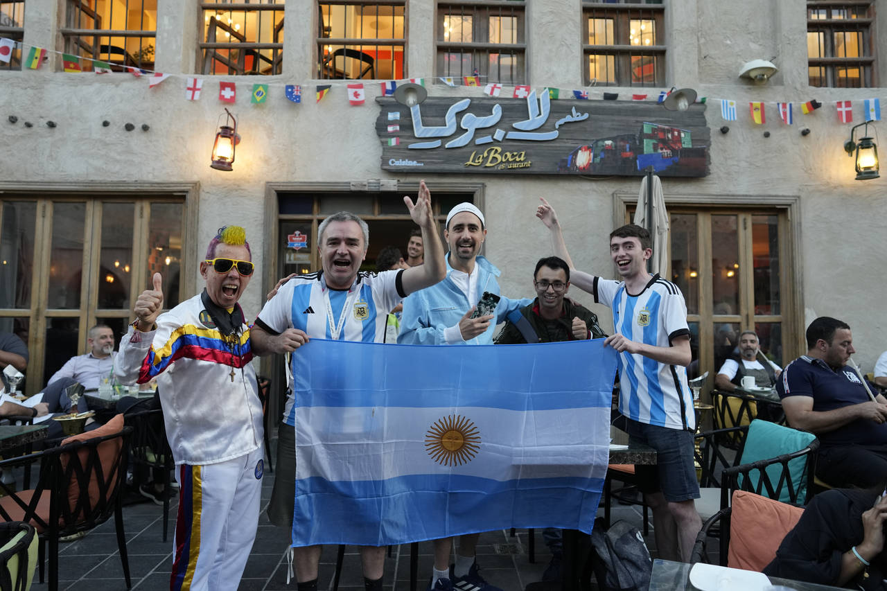 Fans of Argentina cheer for their team in Souq Waqif market in Doha, Qatar, Thursday, Dec. 15, 2022...