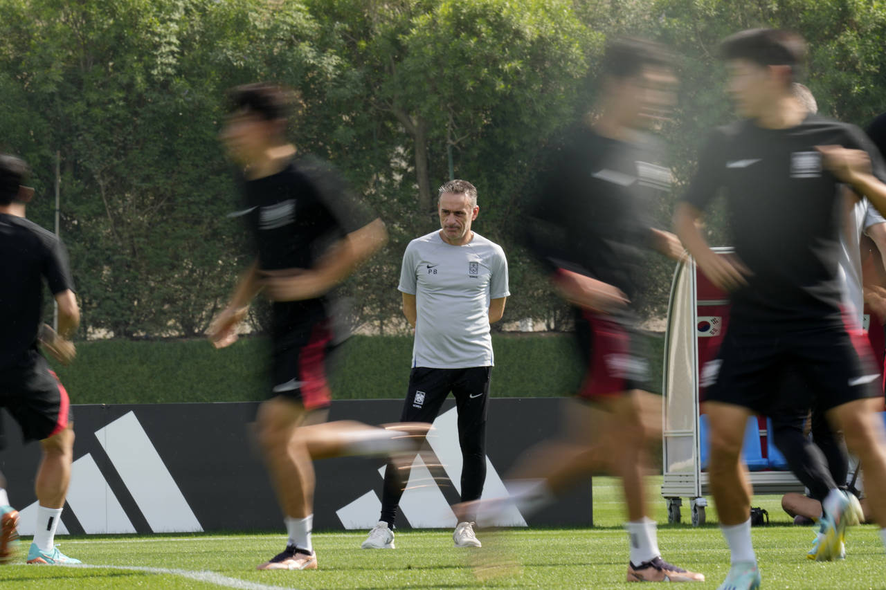 South Korea's head coach Paulo Bento looks at the players during the South Korea's official trainin...