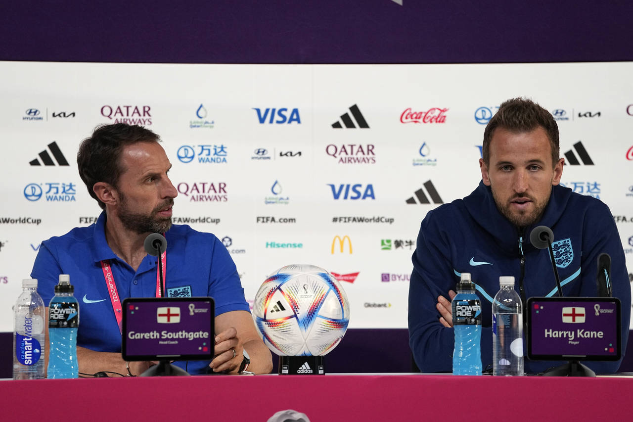 England's head coach Gareth Southgate, left, and Harry Kane speak to the media during a press confe...