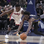 Butler's late flurry helps Heat put away Pacers 87-82