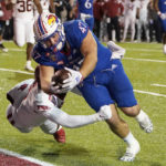 Kansas rallies, but Arkansas wins Liberty Bowl 55-53 in 3OTs