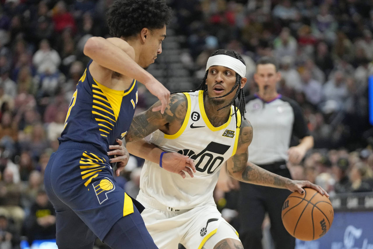 Indiana Pacers guard Andrew Nembhard, left, guards against Utah Jazz guard Jordan Clarkson (00) dur...