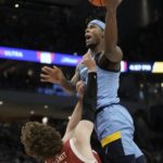 Hepburn paces Wisconsin to 80-77 OT win over Marquette