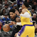 James helps Lakers stop 4-game slide with win over Magic