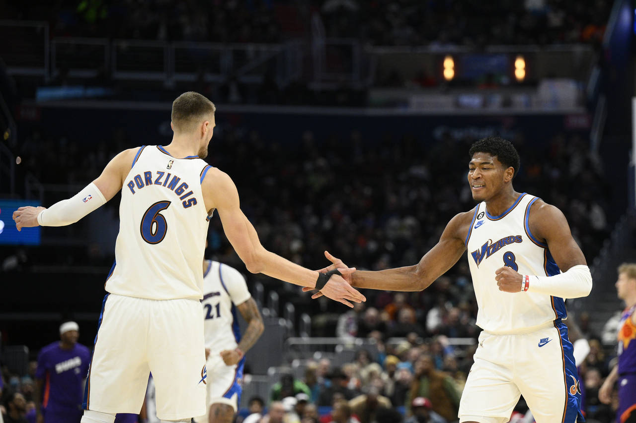 Washington Wizards forward Rui Hachimura (8) celebrates with center Kristaps Porzingis (6) after Ha...
