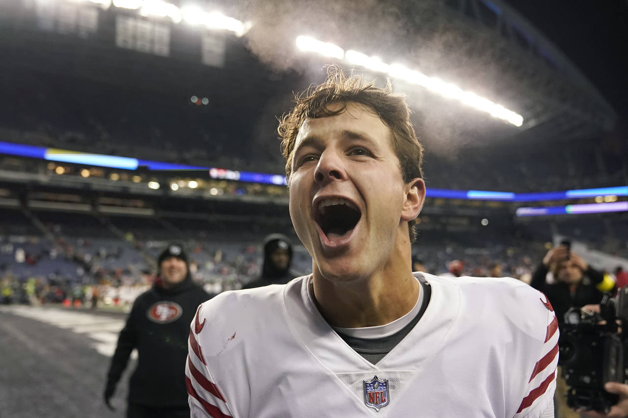 San Francisco 49ers quarterback Brock Purdy celebrates after the 49ers defeated the Seattle Seahawk...