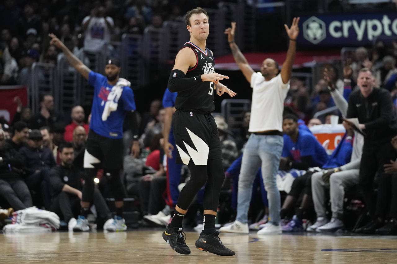 Los Angeles Clippers guard Luke Kennard (5) celebrates after making a 3-pointer during the second h...