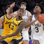 Roach leads No. 15 Duke past Iowa 74-62 in Jimmy V Classic
