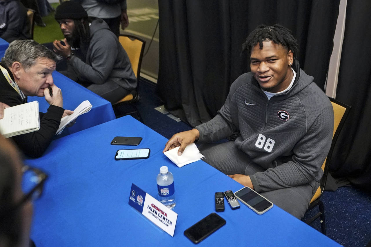Georgia defensive lineman Jalen Carter (88) speaks during media day for the Peach Bowl NCAA college...