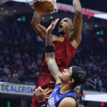 Mitchell scores 34, Cavaliers top Magic 107-96