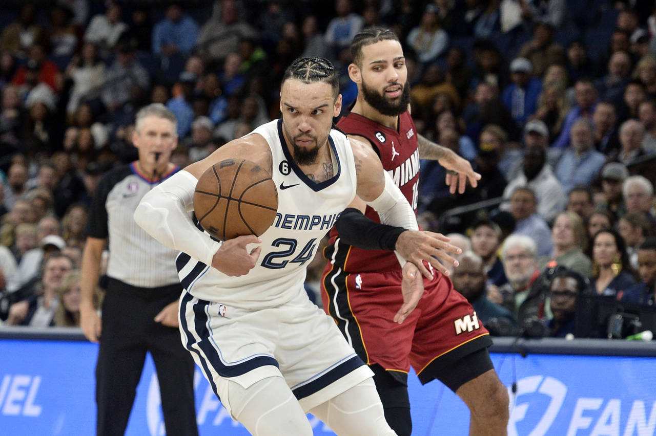 Memphis Grizzlies forward Dillon Brooks (24) handles the ball ahead of Miami Heat forward Caleb Mar...