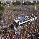 Sea of people try to catch glimpse of Argentina soccer team