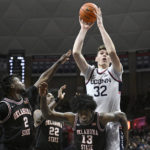 Hawkins leads unbeaten No. 8 UConn past Okla St 74-64