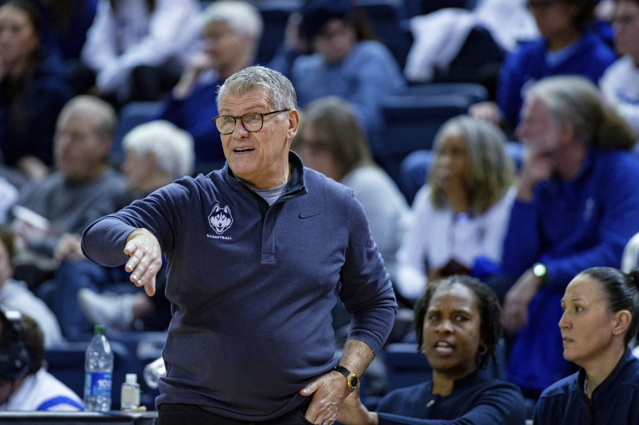 UConn coach Geno Auriemma gestures during the team's NCAA college basketball game against Creighton...