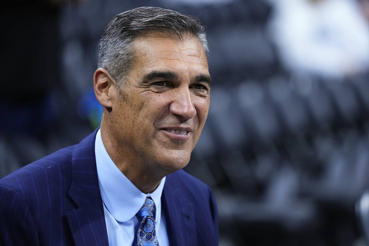 FILE - Former Villanova head coach Jay Wright smiles before an NCAA college basketball game between...