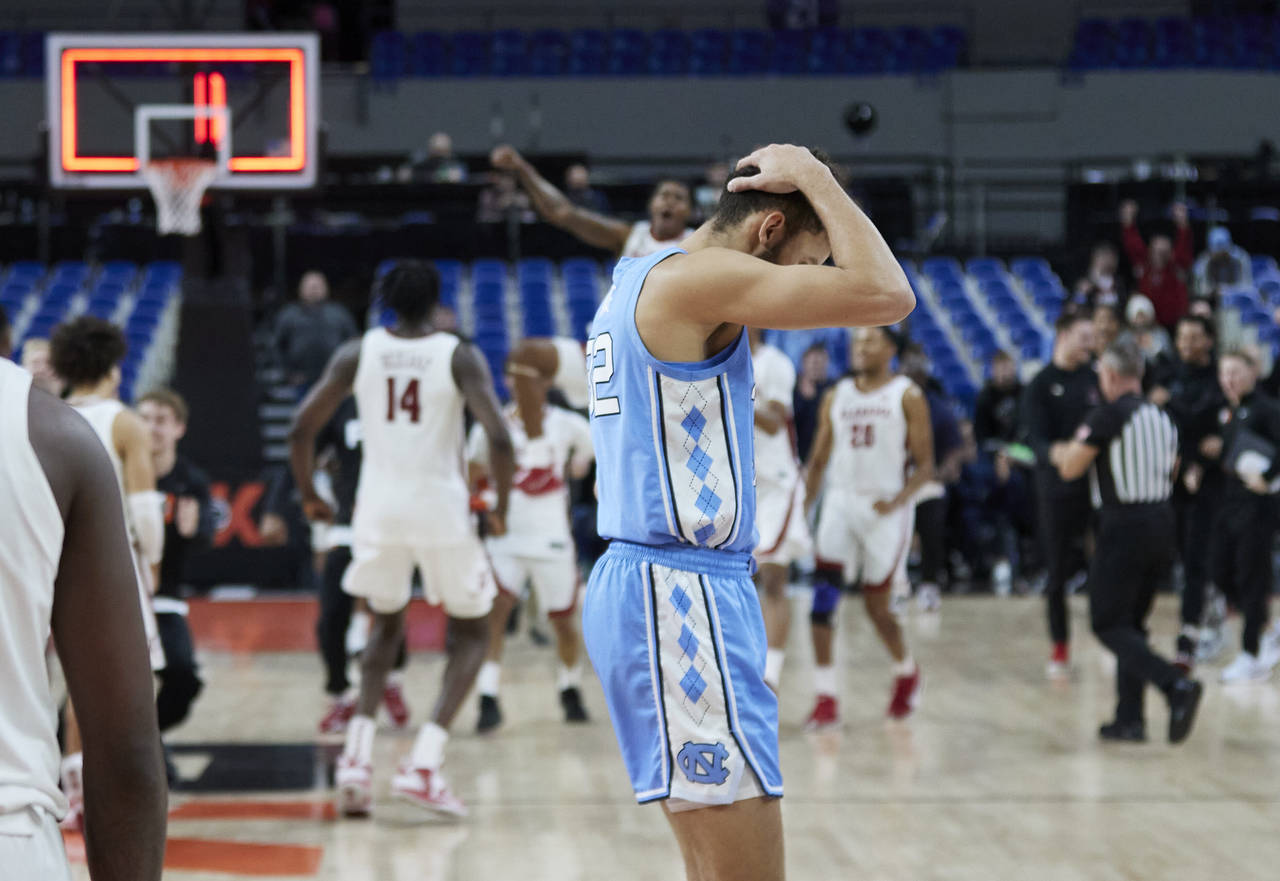 North Carolina forward Pete Nance reacts to the team's 103-101 loss to Alabama in four overtimes in...